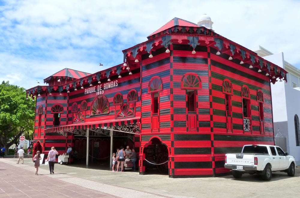 The black and red exterior of Parque de Bombas, one of the best things to do in Puerto Rico with kids.
