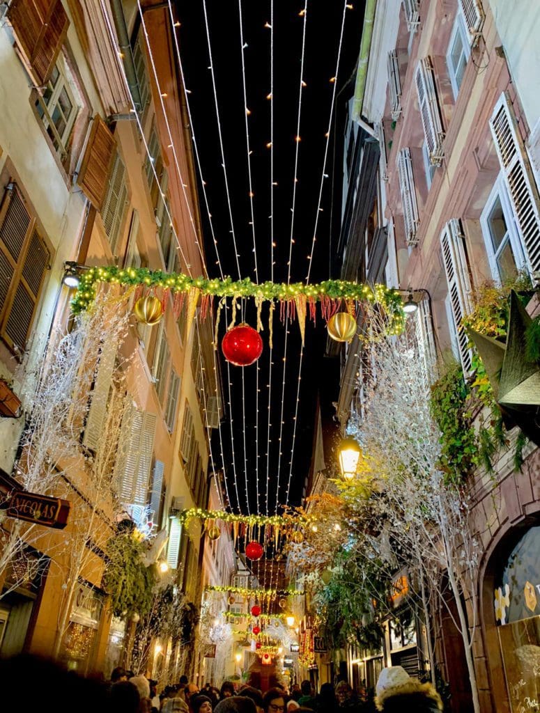 A lovely street in Strasbourg decorated for Christmas, one of the best places for Christmas for families in the world.