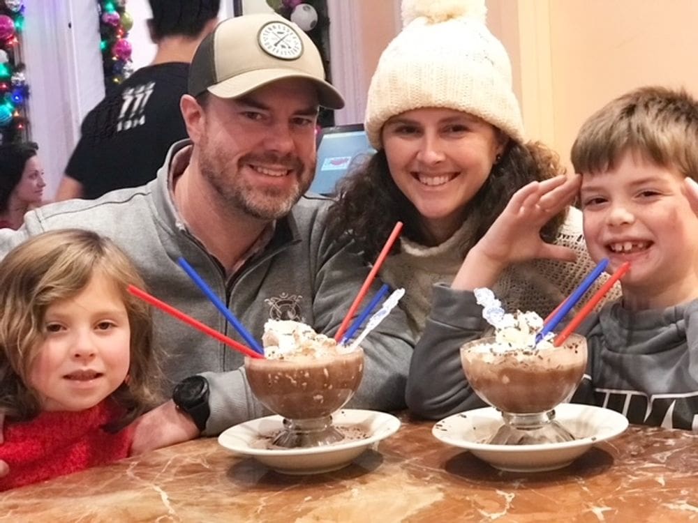 A family of four enjoys a sweet treat during a Christmas vacation to NYC.