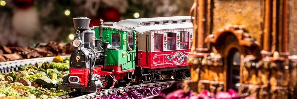 A miniature holiday trail barrels down the track at the New York Botanical Garden Holiday Train Show, one of the best New York City Christmas activities with kids.