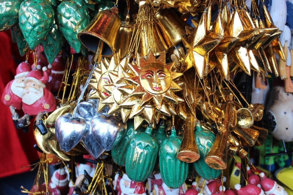 A close up of several Christmas ornaments for sale at a stall at the Union Square Holiday Market.