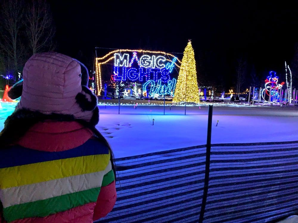A young girl looks at holiday lights, as part of a display in Vail.
