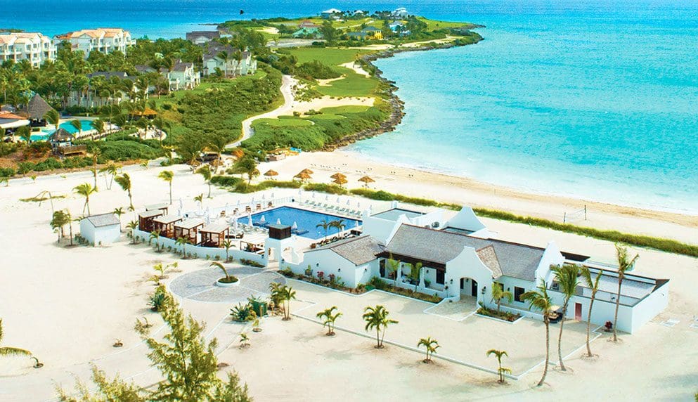 An aerial view of the Grand Isle Resort & Spa, Great Exuma, featuring an oceanside location, one of the best hotels in the Bahamas for families.