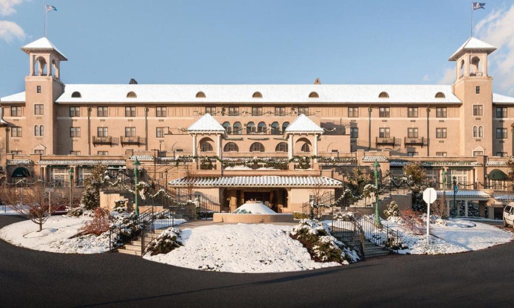 The exterior entrance to Hotel Hershey, dusted with snow in the winter.