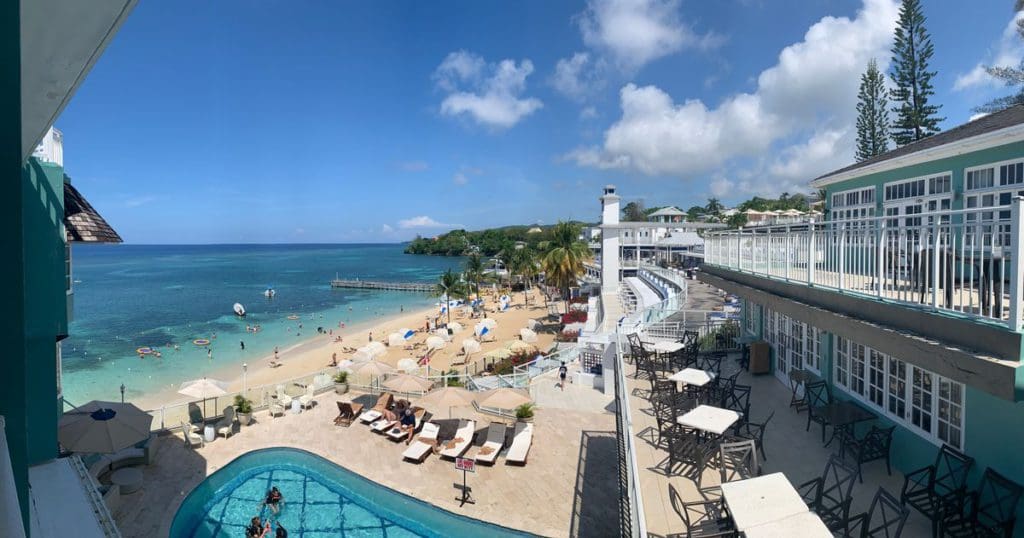 A view of Beaches Ocho Rios from a balcony room, onto the stunning beach and pool below.