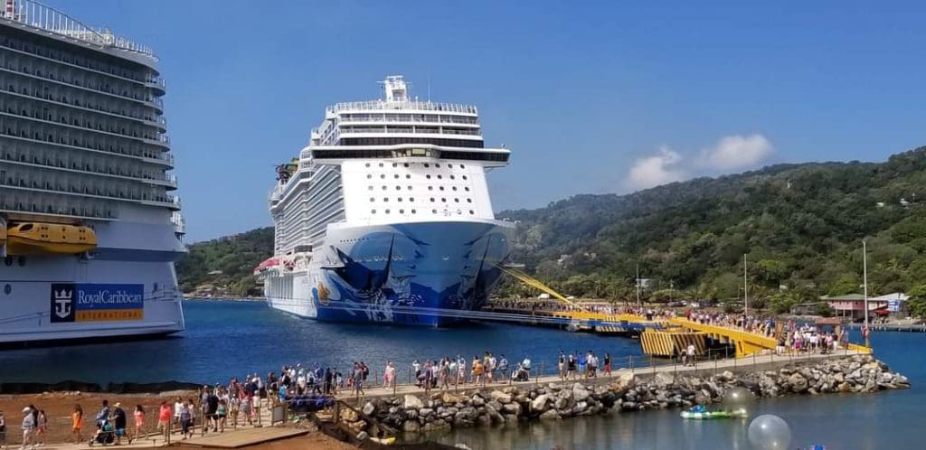 A large Norwegian Cruise Line ship awaits guests in port, one of the best cruise lines for families.