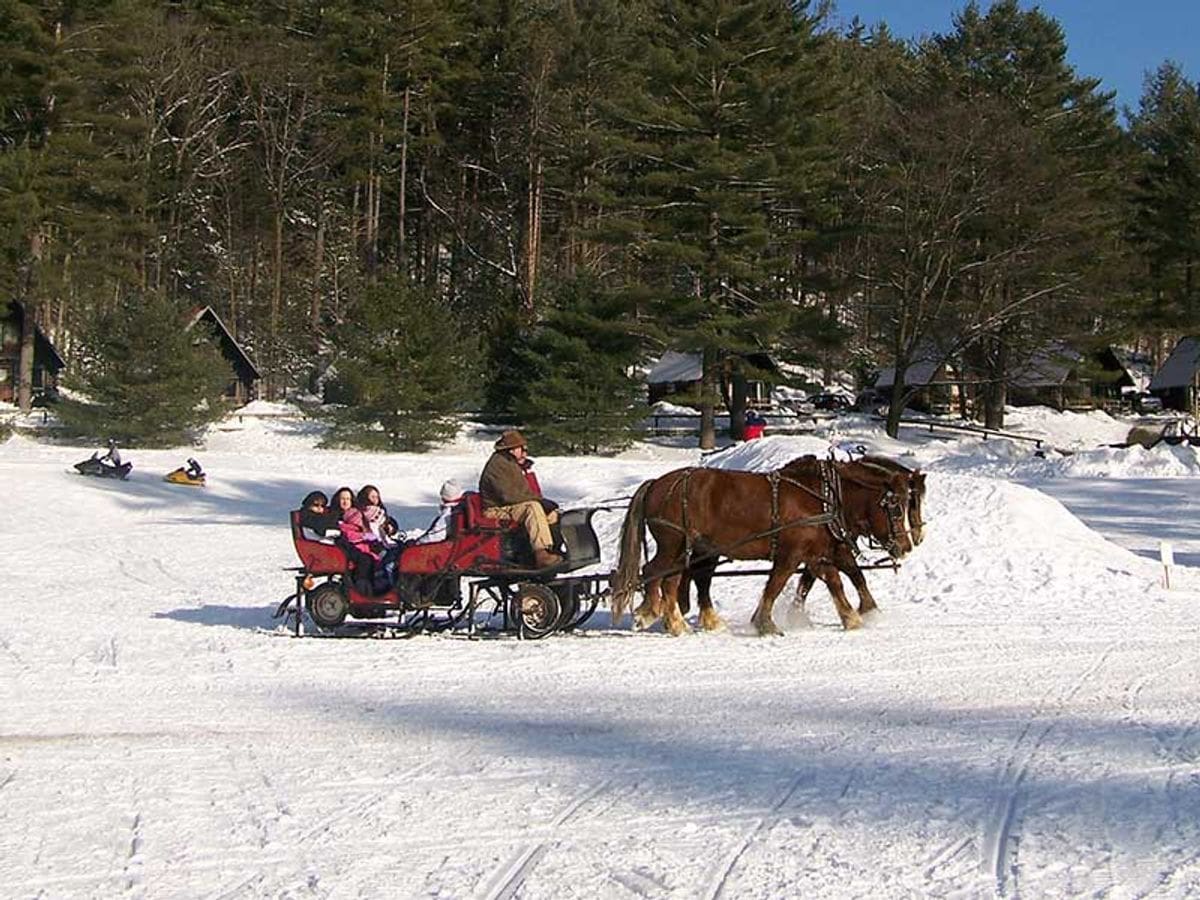A sleigh ride over snow at the Ridin-Hy Ranch Resort.