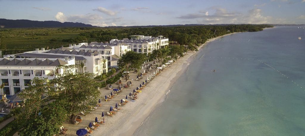 An aerial view of the hotel grounds and beach at the Azul Beach Resort Negril, one of the best all-inclusive resorts in Jamaica for families.