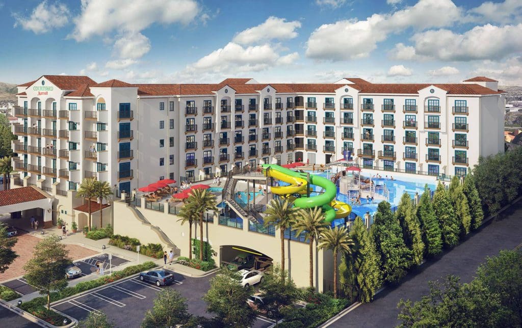 An aerial view of Courtyard by Marriott Anaheim Theme Park Entrance, featuring its large on-site waterpark at one of the Best Marriott Properties in the U.S. for a Family Vacation.
