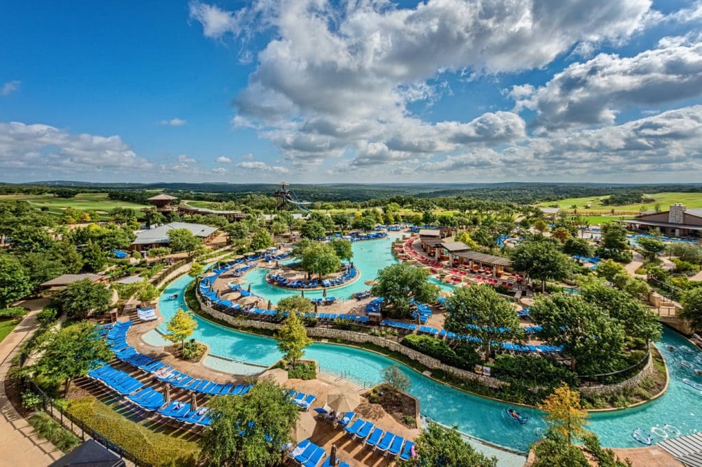 A view of the lazy river and pool, plus surrounding pool deck, at JW Marriott San Antonio Hill Country Resort & Spa.