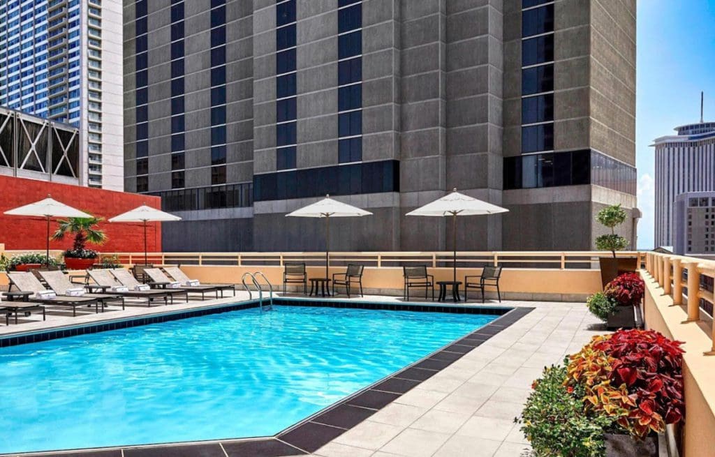 The terrace pool at JW Marriott New Orleans, featuring a large pool deck and skyline view.