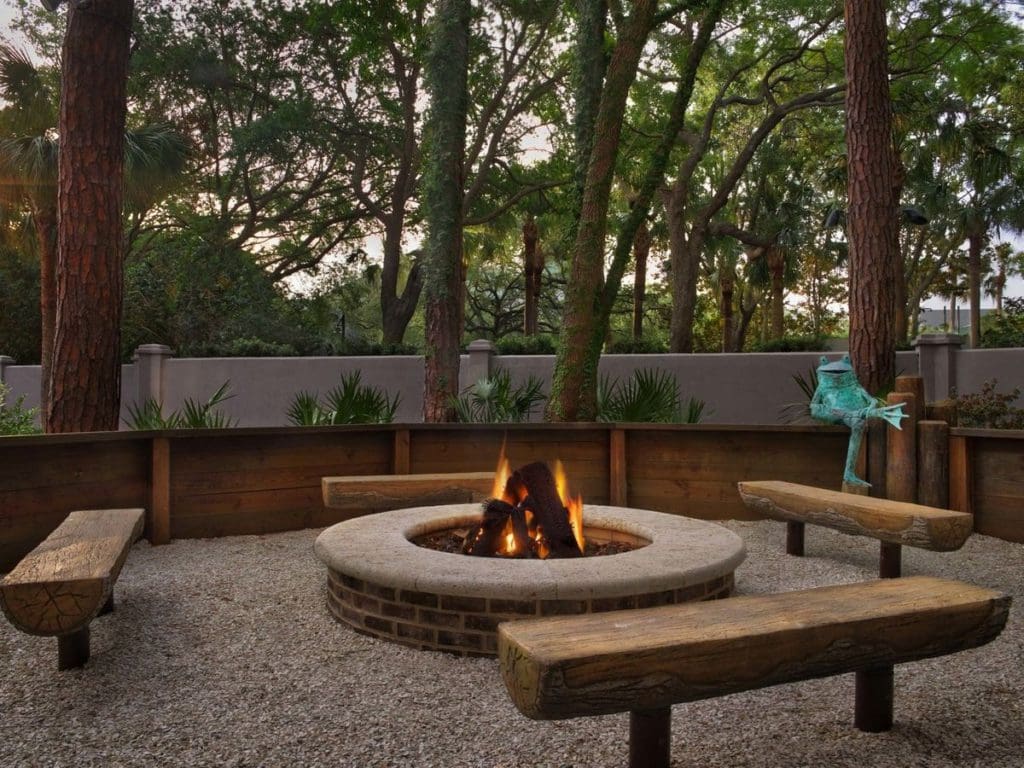 A cozy bonfire space at Marriott's Barony Beach Club, with four benches at one of the Best Marriott Properties in the U.S. for a Family Vacation.