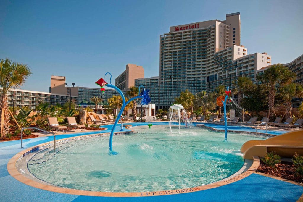 The splash pad at Orlando World Center Marriott, with resort buildings in the distance.