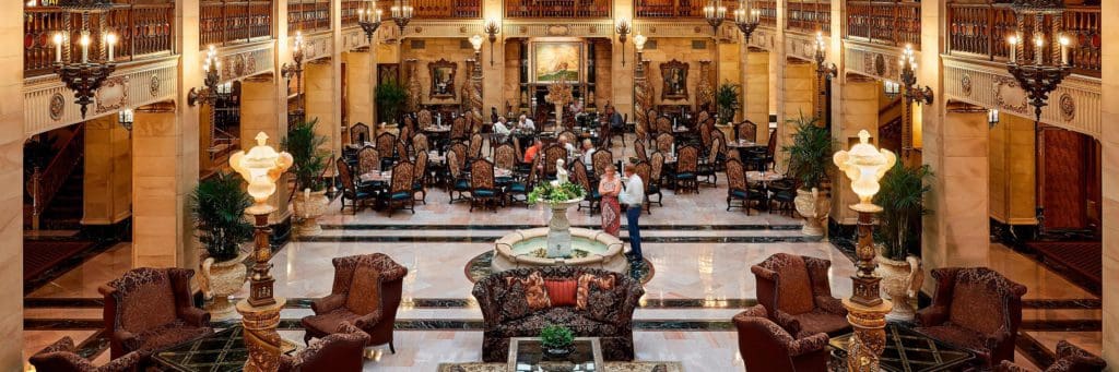 The grand, ornately decorated lobby of The Historic Davenport, Autograph Collection, one of the best themed hotels on the West Coast for families