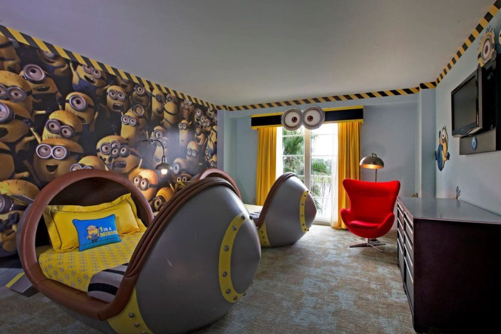 Inside the Despicable Me room at Loews Portofino Bay Resort, featuring a Minions wall paper and torpedo-shaped beds.
