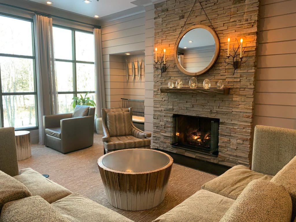 Inside the tranquil spa at Woodloch Resort, featuring a fireplace and plush seating area.