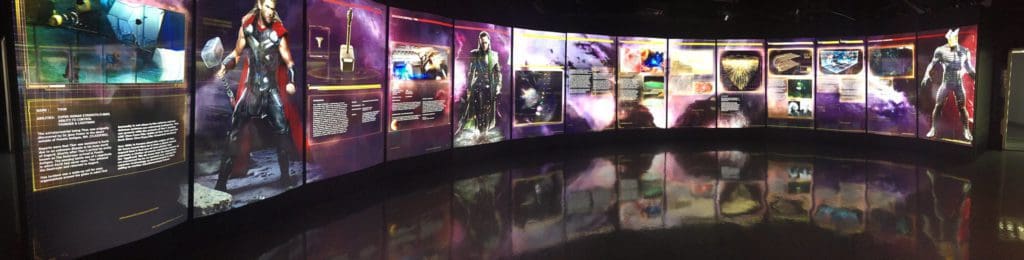 Several characters from the Marvel universe line up across a digital screen at Marvel Avengers S.T.A.T.I.O.N.