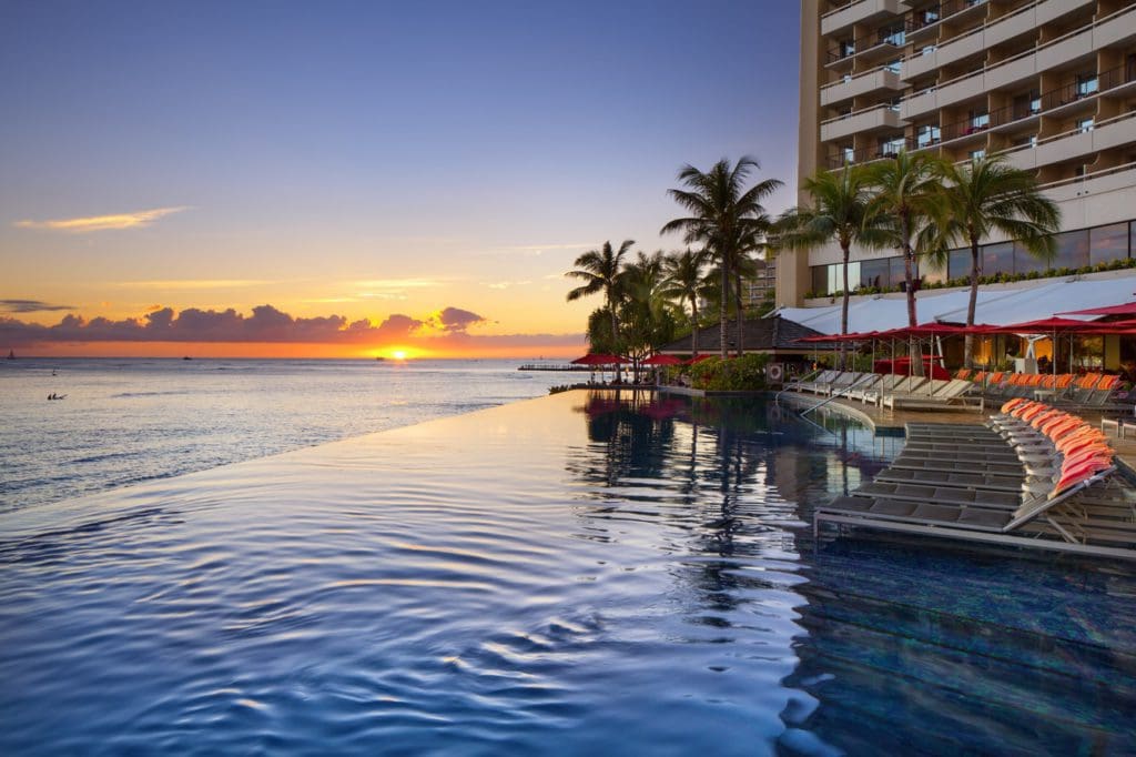 The stunning pool facing the ocean at Sheraton Waikiki during a postcard-perfect sunset.