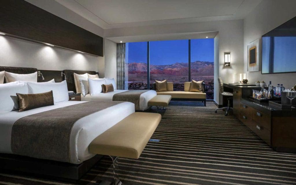 Inside a double, Queen bed room at Red Rock Casino Resort and Spa, featuring a view out onto Las Vegas.