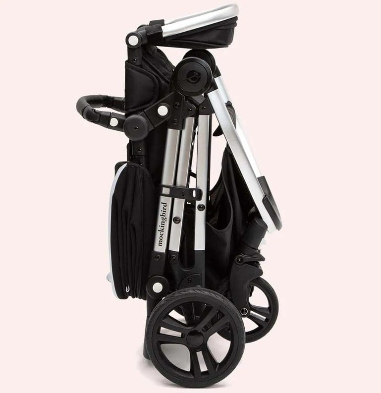 A product shot of the Mockingbird Single-to-Double Stroller folded up.