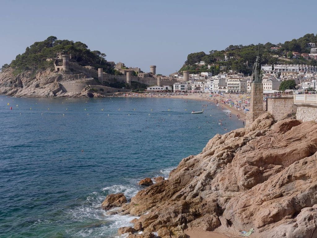 Along the cost of Costa Brava, featuring a rocky area, with a beach nestled inside.