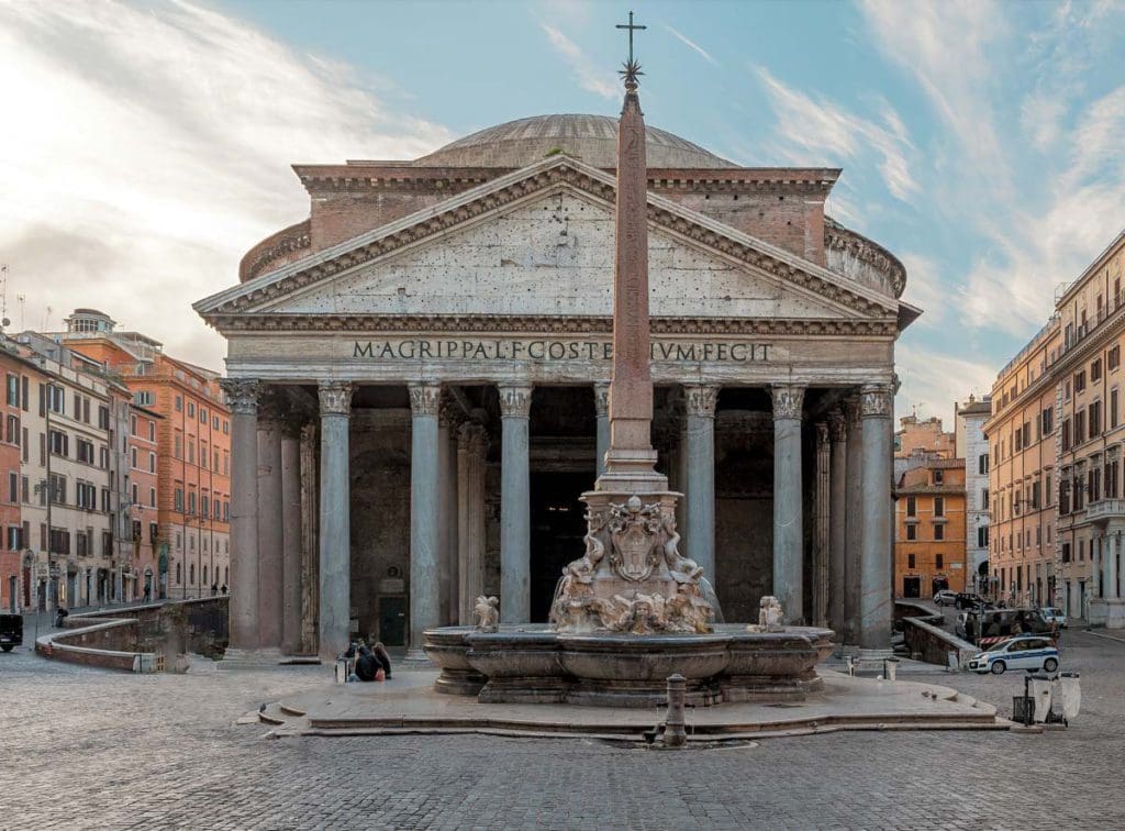 The entrance to the Pantheon in the early morning, with an empty piazza out front.