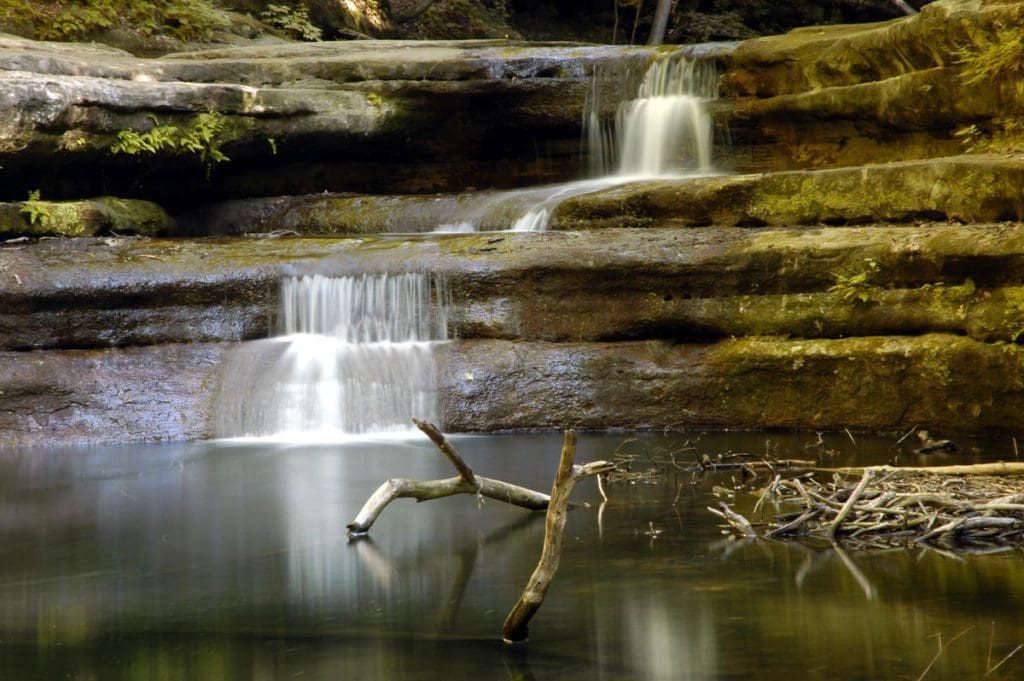 The lovely waterfall inside Matthiessen State Park, flows over large rock cut outs at one of the best places in Northern Illinois for families
