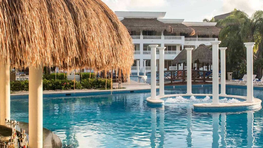 A pool, near the covered cabanas, at Grand Sunset Princess, one of the best all-inclusive resorts Playa del Carmen for families.