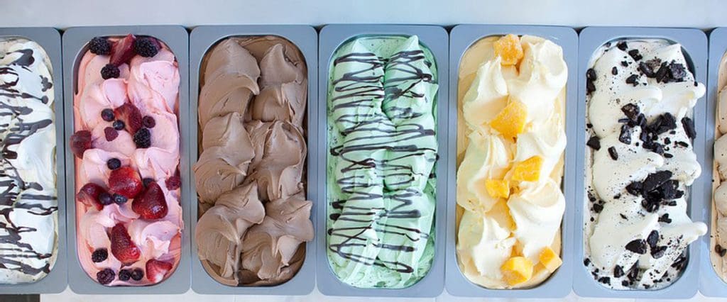 An aerial view of six colorful gelato flavors at Dolci Gelati.