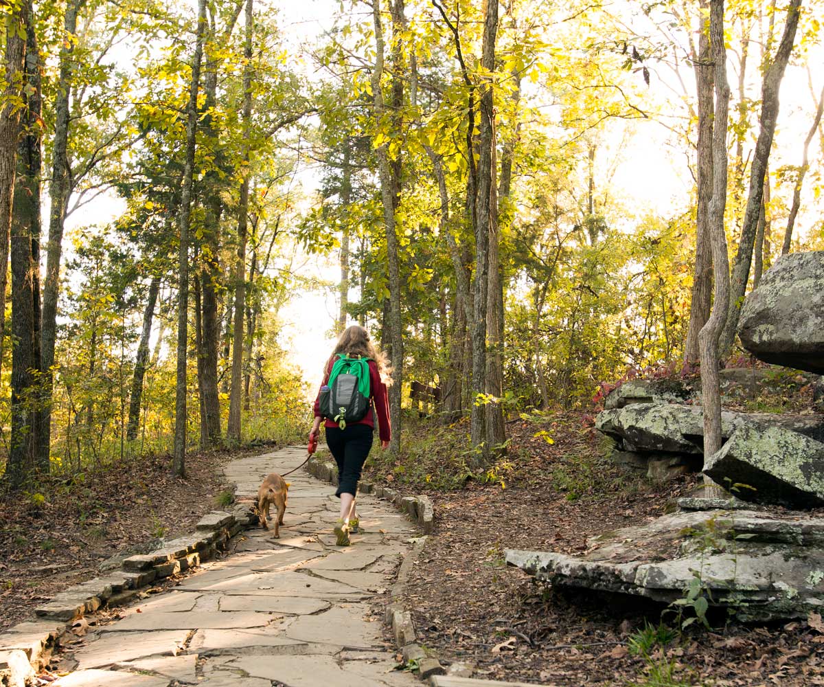 Girl hiking in the Shawnee national forest with her dog.