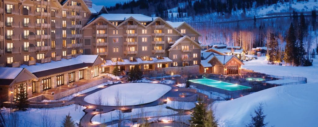 A view of the outdoor heated pool during the winter at Montage Deer Valley, one of the best luxury hotels in the U.S for families.