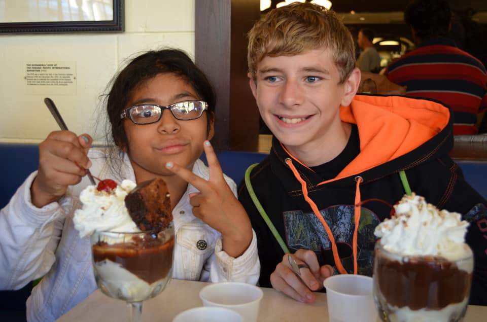 Two kids indulge their sweet tooth with treats from Ghirardelli Sqaure.