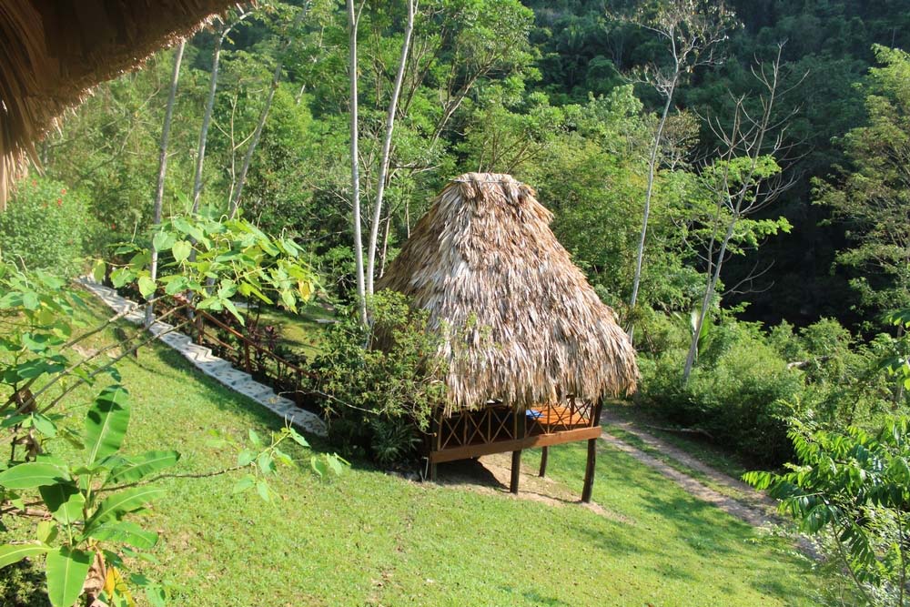 A small thatch-roof cabana at Black Rock Lodge.
