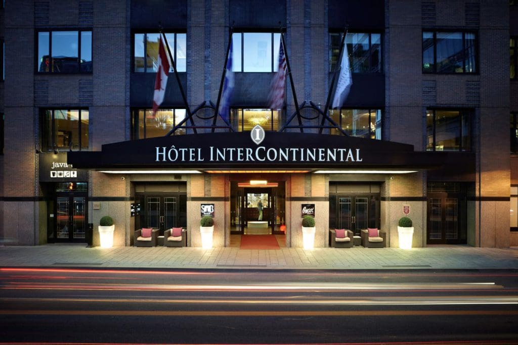 The exterior entrance to InterContinental Montreal, an IHG Hotel at night.