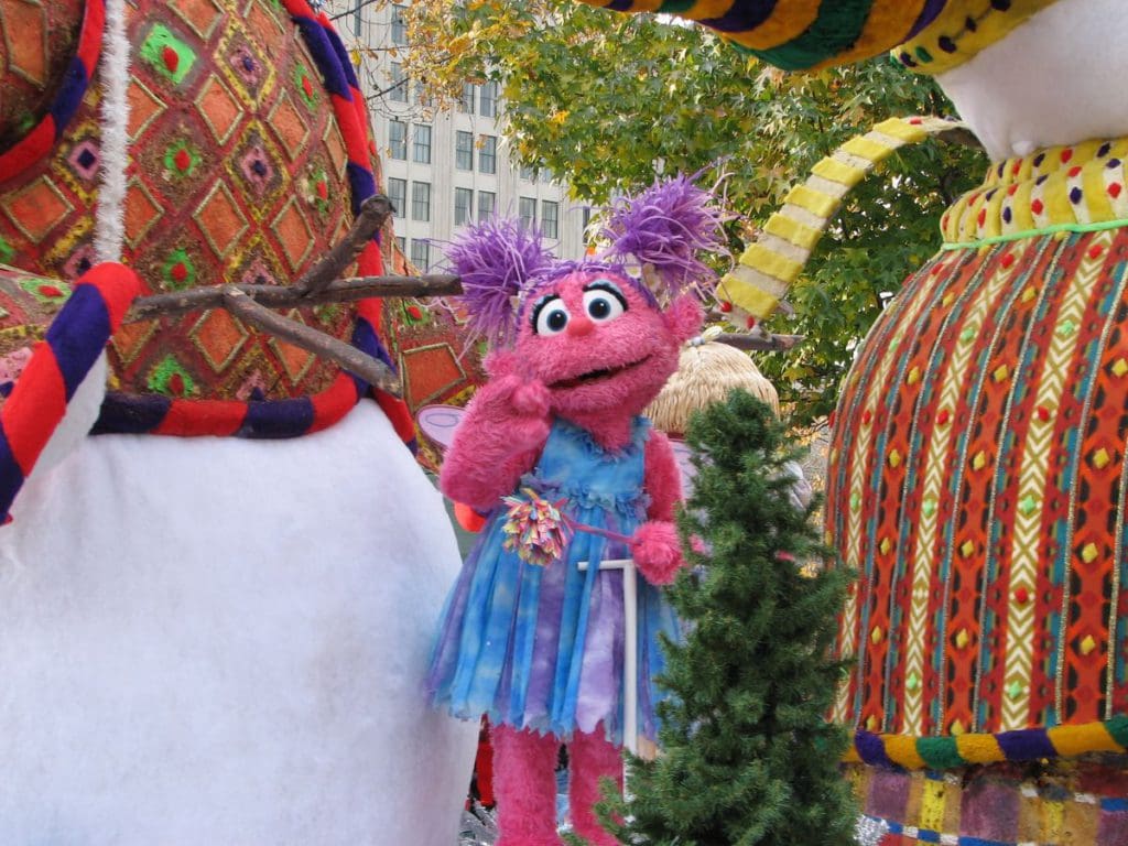 A Sesame Street character waves from a Thanksgiving Day parade float in Philadelphia.