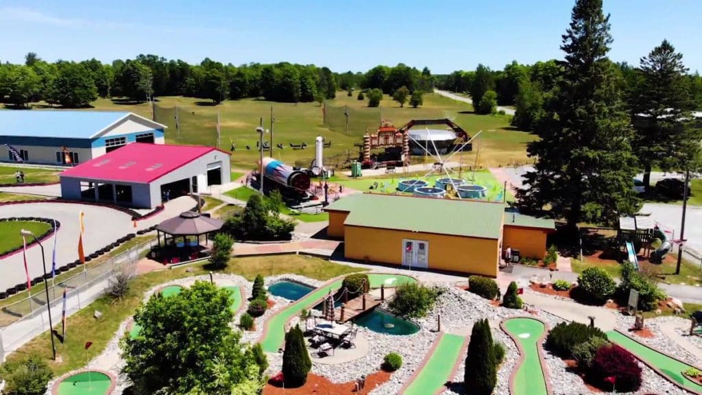 An aerial view of Arzo Amusement Park, featuring mini golf and a go-kart track.