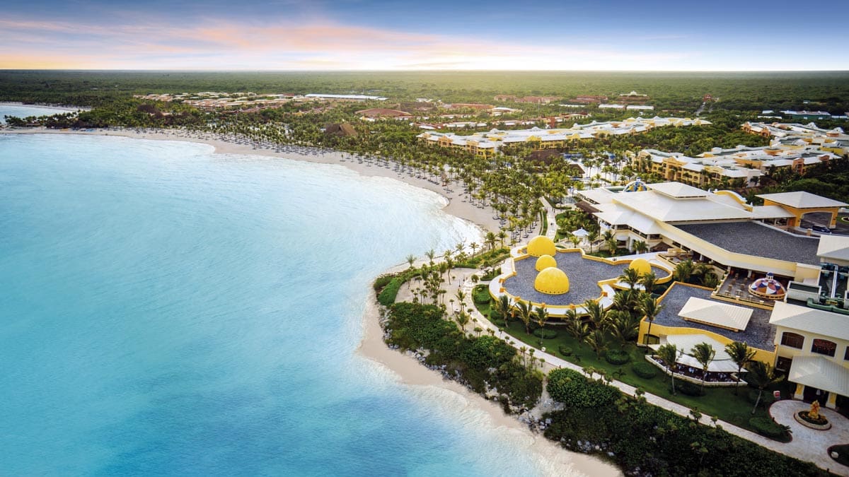 An aerial view of the oceanside view of Barceló Maya Palace, one of the best resorts in Mexico with a water park for families.
