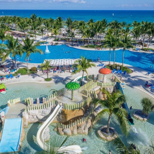An aerial view of the large water park at Barceló Maya Palace, one of the best resorts in Mexico with a water park for families.