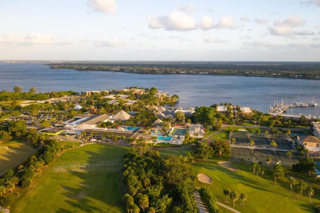 An aerial of the Club Med Sandpiper Bay property, nestled along the water.