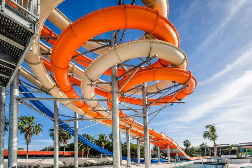 Two colorful water slides twist and turn overhead at Hard Rock Riviera Maya.