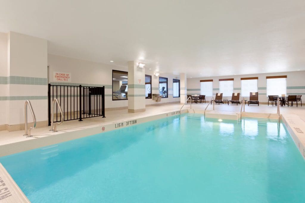 The large indoor pool in an airy room at Hyatt Place Austin Downtown.