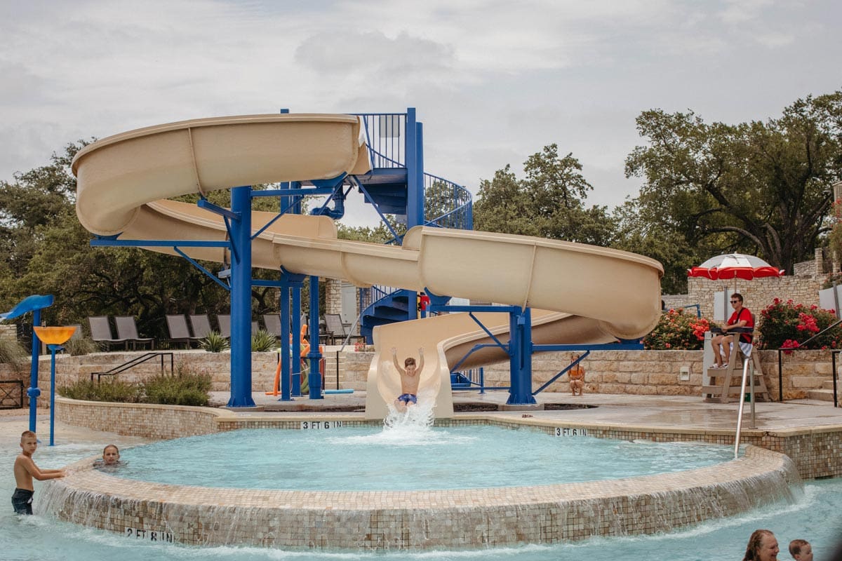 A child shoots down a waterslide at Lakeway Resort and Spa.