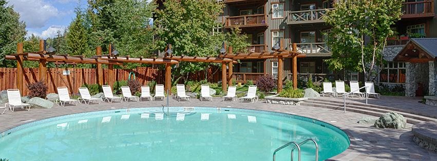 The outdoor pool and surrounding pool deck at Lost Lake Lodge, one of the best all-inclusive hotels in the United States for families.