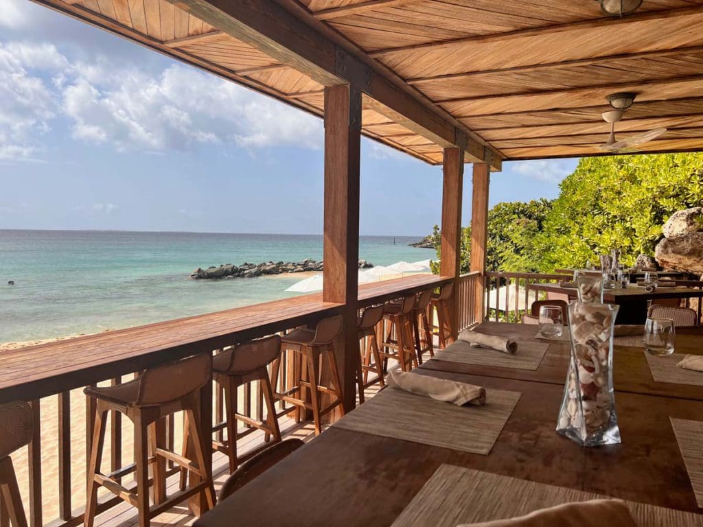 An open air dining room at the one of the on-site restaurants at Four Seasons Anguilla.