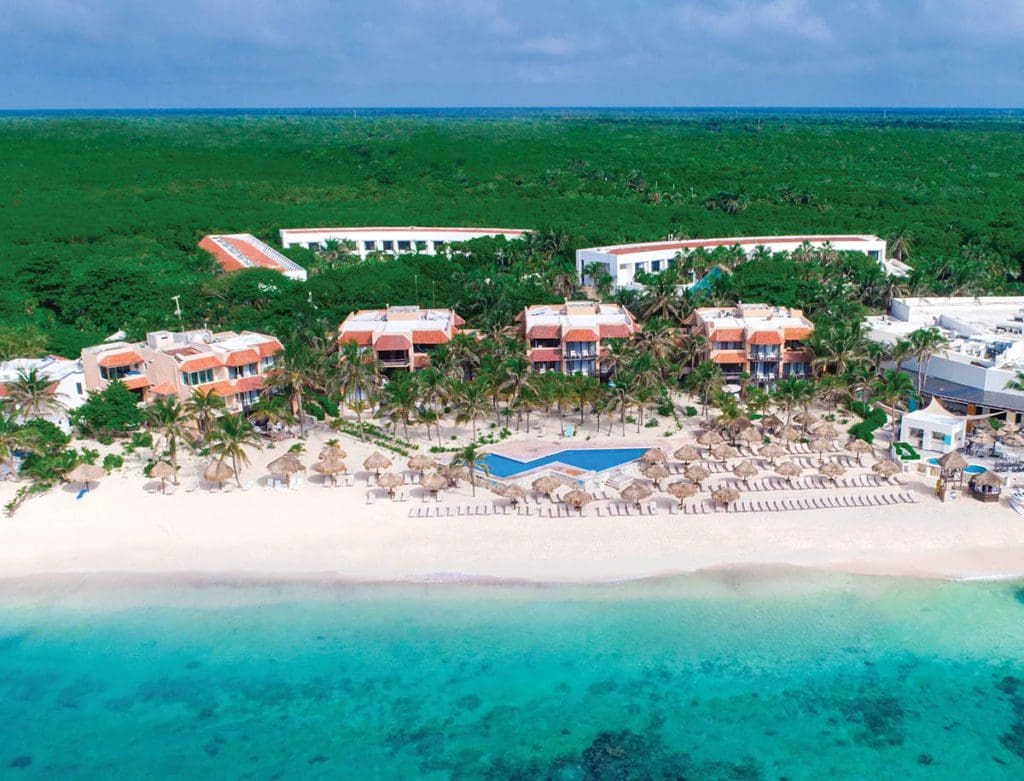 An aerial view of Sunscape Akumal Beach Resort & Spa, nestled along the beach at one of the best resorts in Mexico with a water park for families.