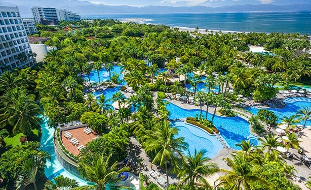 An aerial view of the grounds, hotel buildings, and pools at The Grand Mayan Nuevo Vallarta.