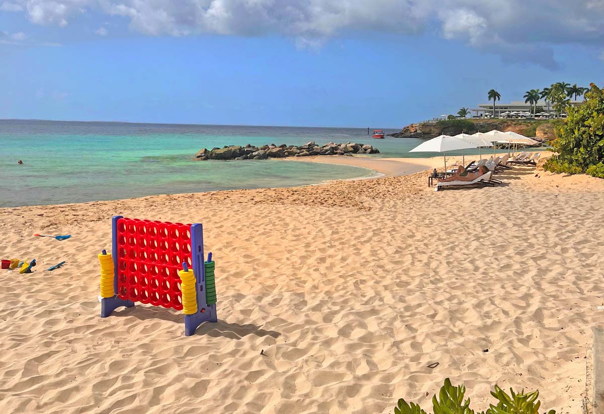 Beach games set up in the sand, including Connect Four, at Four Seasons Resort and Residences Anguilla.