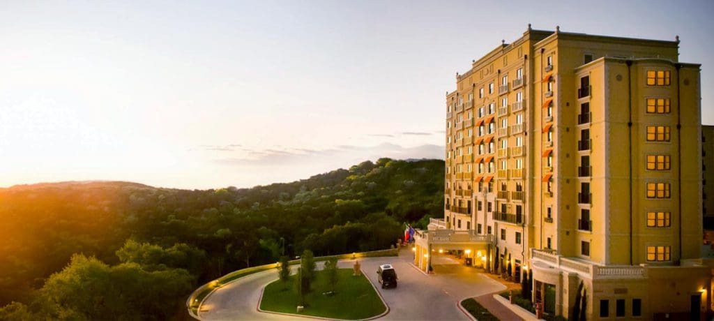 The exterior of Hotel Granduca Austin overlooking a scenic view.