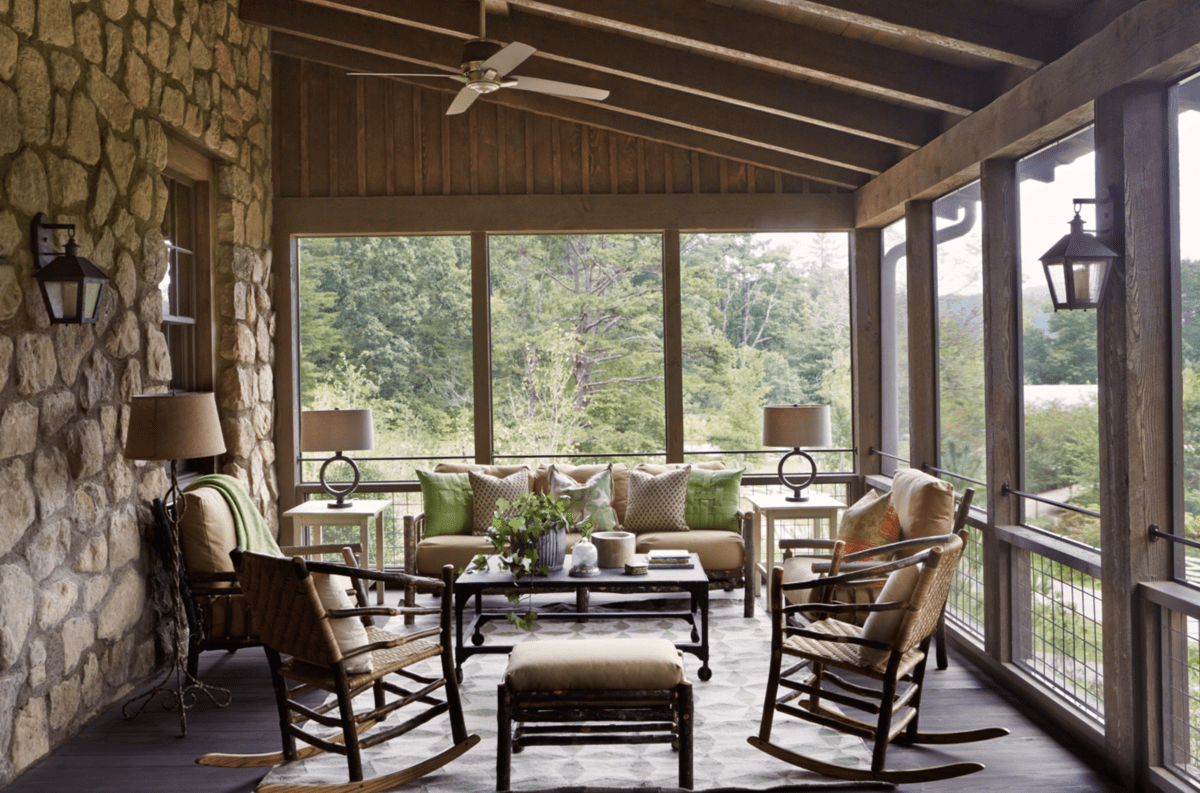 A cozy porch with lush seating at Blackberry Farm.