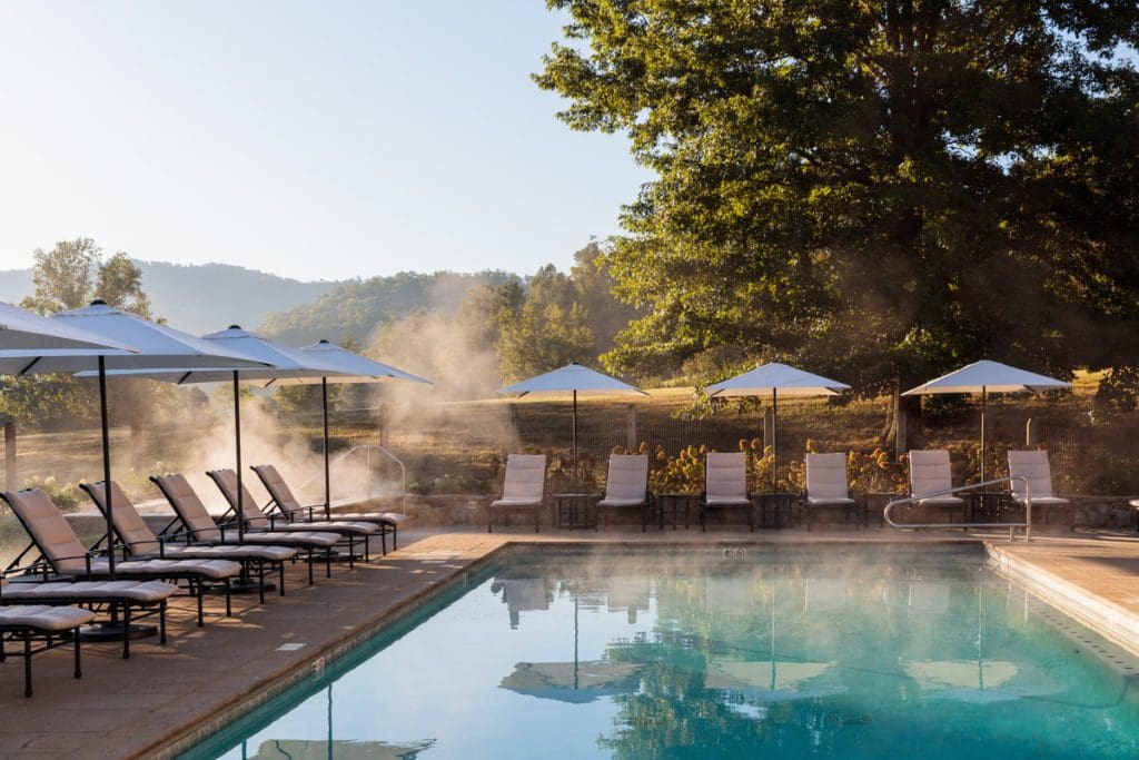 The intimate outdoor pool, with surrounding pool deck with loungers at Blackberry Farm.